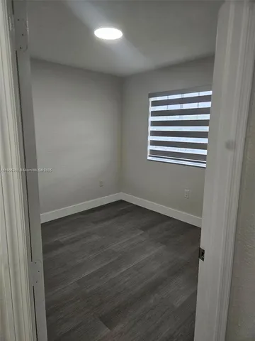 a bathroom with a toilet a sink and bathtub
