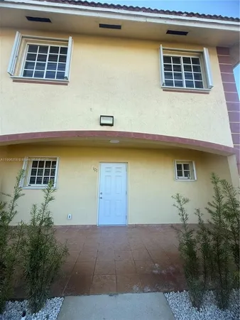 a front view of a house with lake