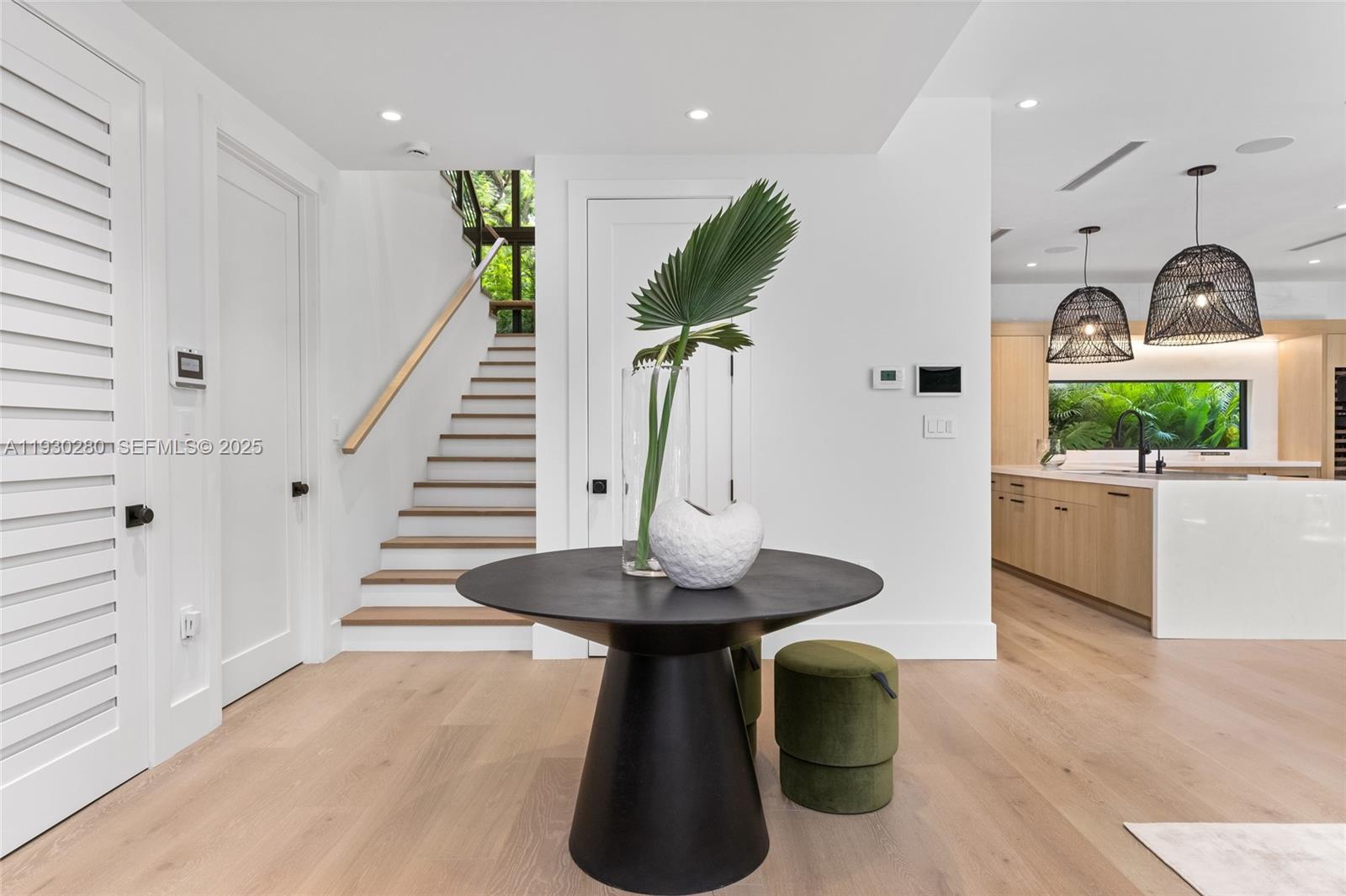 4024 Bonita Avenue Miami, FL 33133 - Photo 11 of 99 a view of a livingroom with furniture and a floor to ceiling window