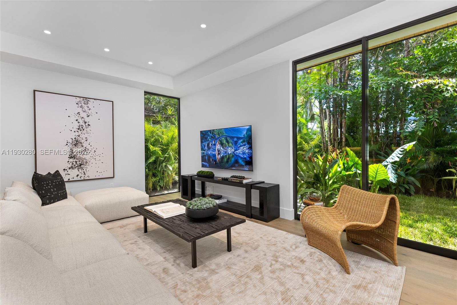 4024 Bonita Avenue Miami, FL 33133 - Photo 28 of 99 a living room with furniture and a large window