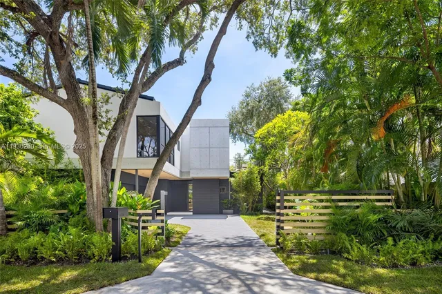 a view of a livingroom with furniture and a floor to ceiling window