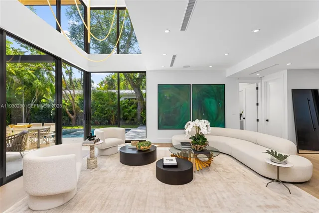 a bedroom with a large bed and a large window