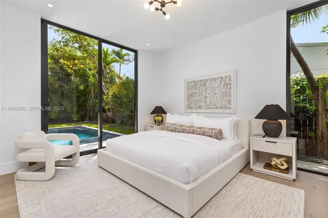 a view of a swimming pool with a patio and a yard