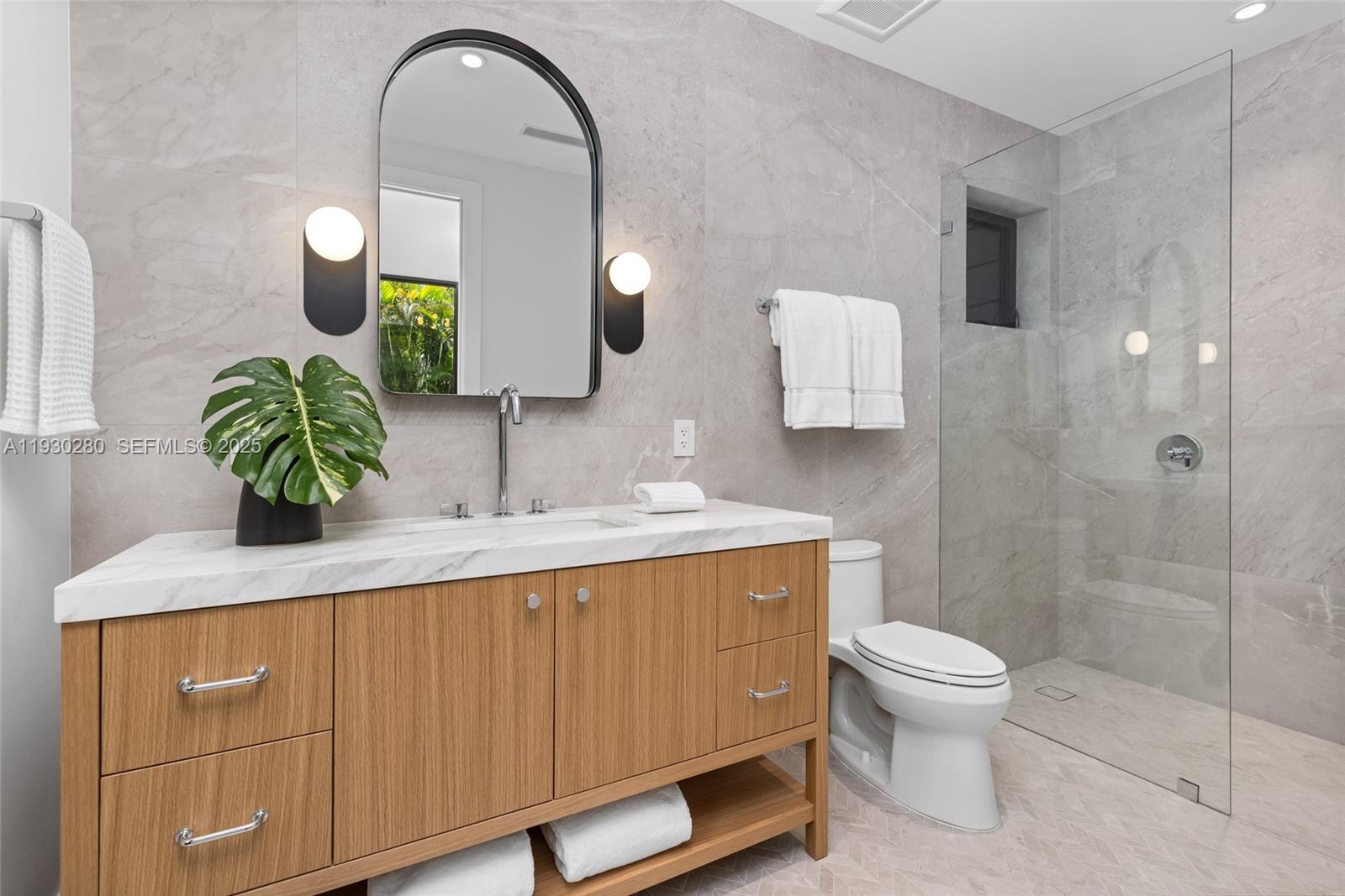 4024 Bonita Avenue Miami, FL 33133 - Photo 41 of 99 a bathroom with a sink toilet and shower