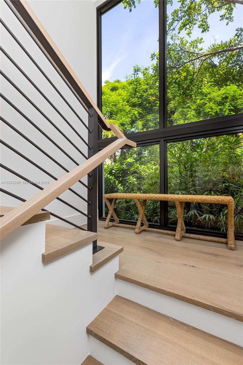 4024 Bonita Avenue Miami, FL 33133 - Photo 42 of 99 a view of swimming pool with seating area and trees in the background