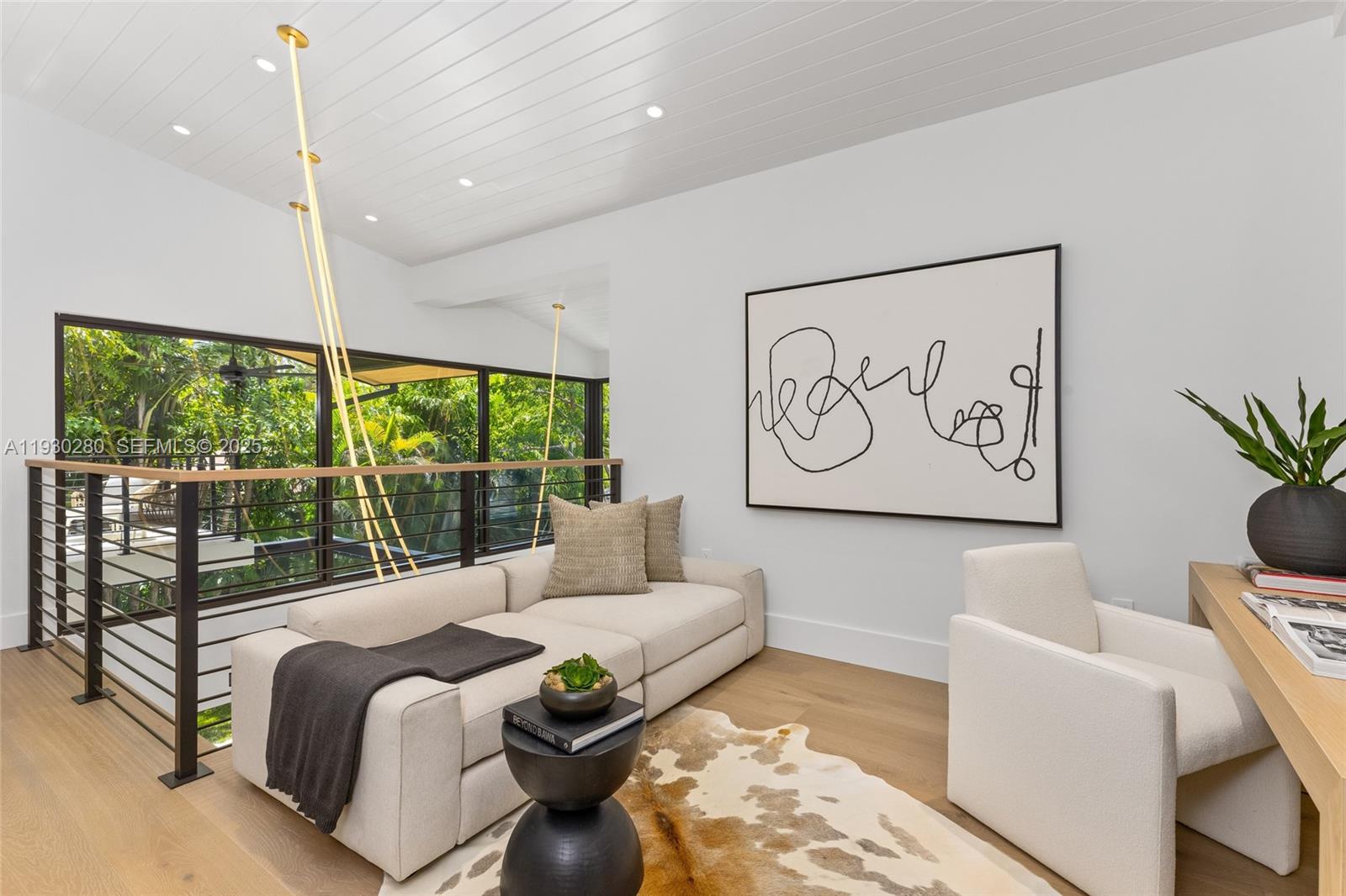 4024 Bonita Avenue Miami, FL 33133 - Photo 44 of 99 a living room with large window and a potted plant