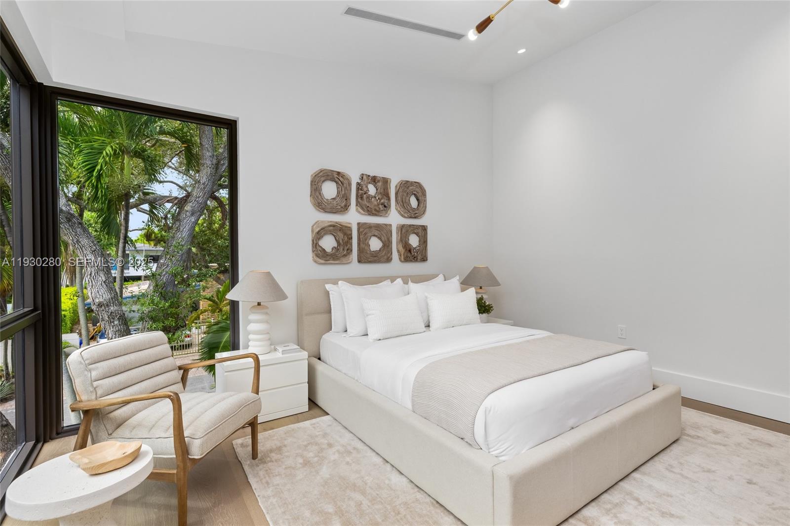 4024 Bonita Avenue Miami, FL 33133 - Photo 66 of 99 a bedroom with a bed and a painting on the wall