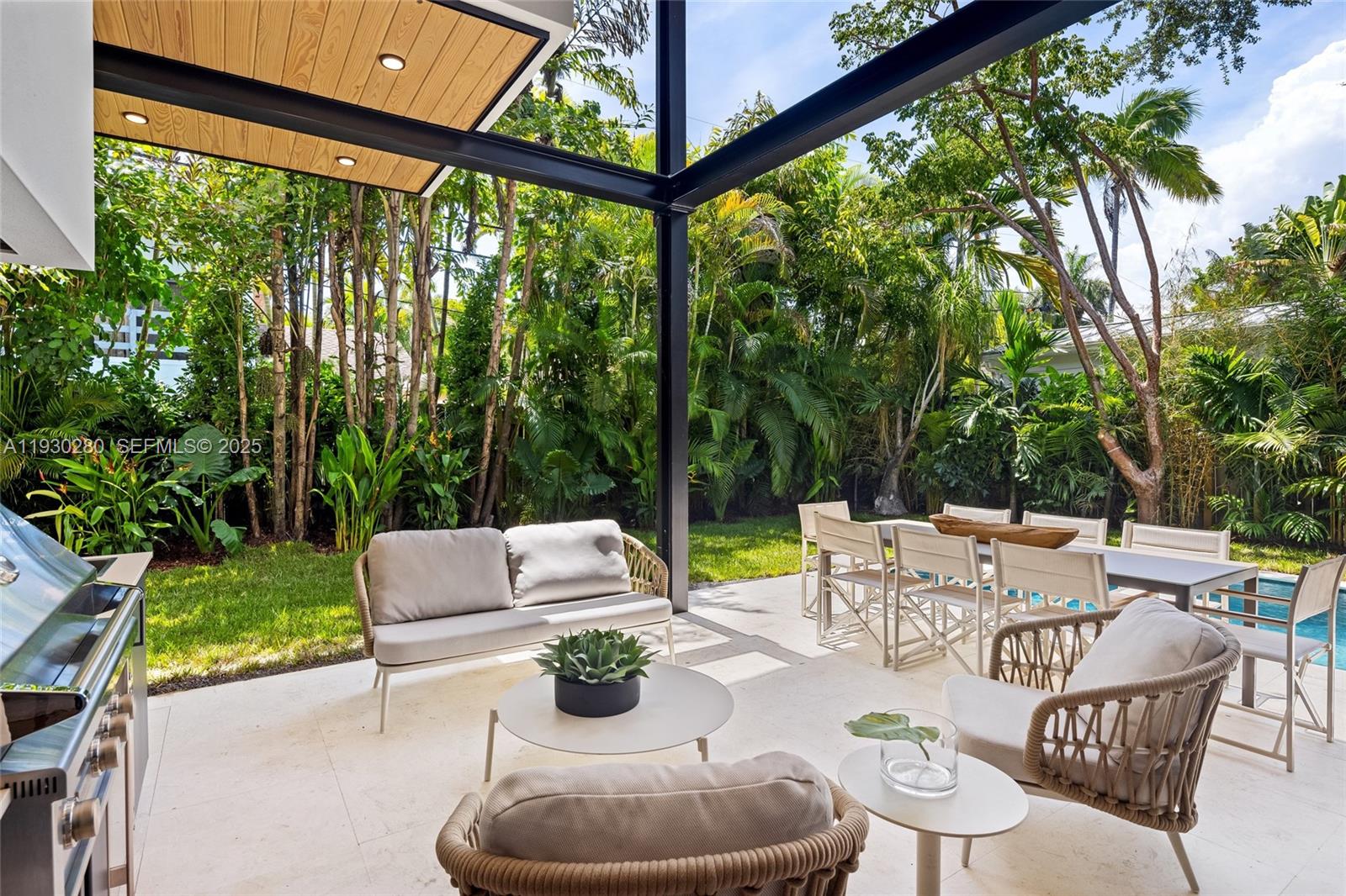 4024 Bonita Avenue Miami, FL 33133 - Photo 70 of 99 a view of an outdoor sitting area with furniture and a yard
