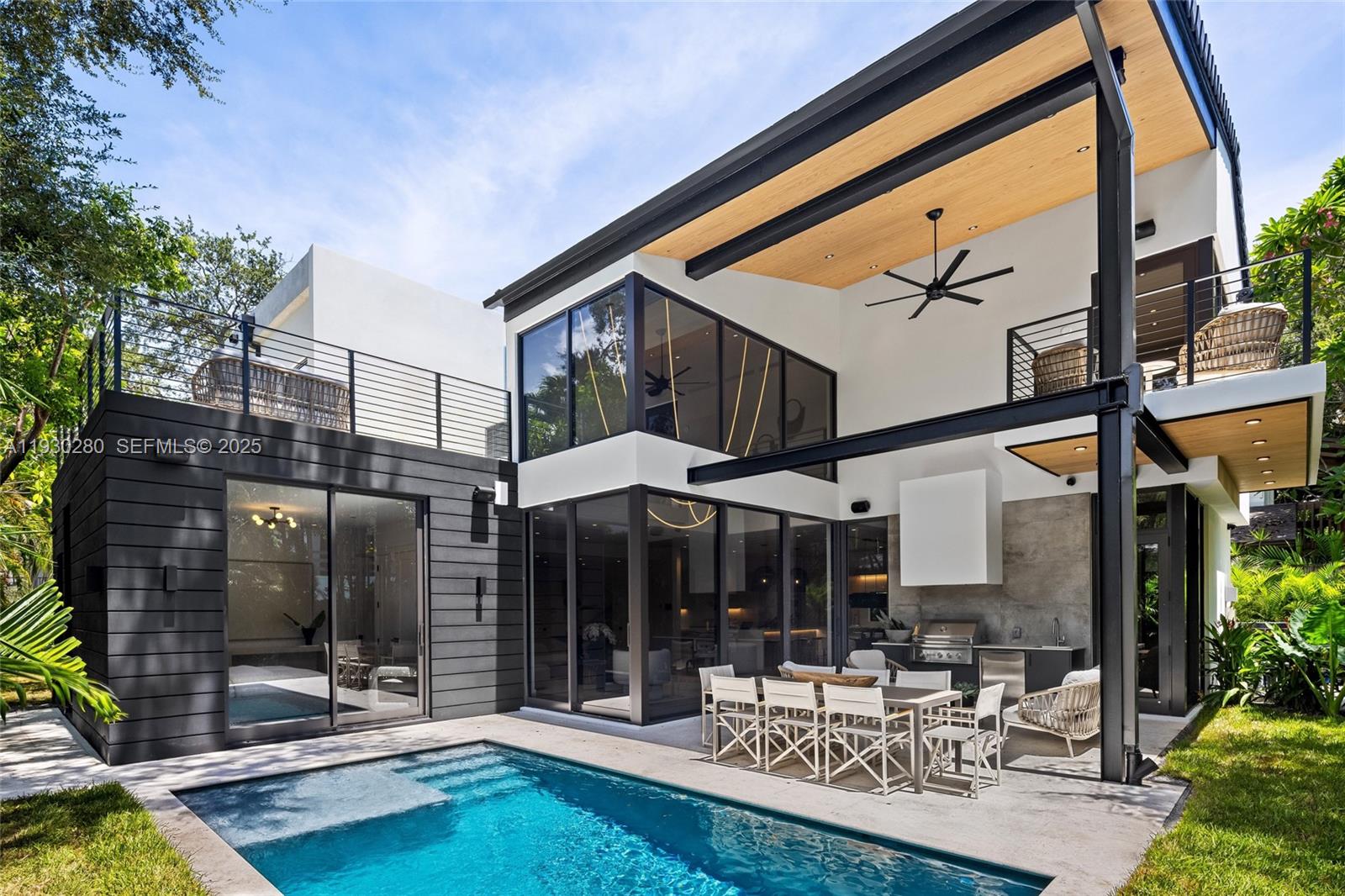 4024 Bonita Avenue Miami, FL 33133 - Photo 83 of 99 a patio with a table and chairs and potted plants