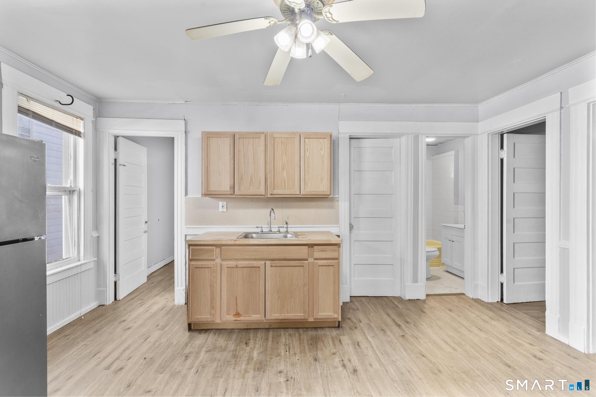 73 South Street Waterbury, CT 06706 - Photo 13 of 29 a room with cabinets and wooden floor