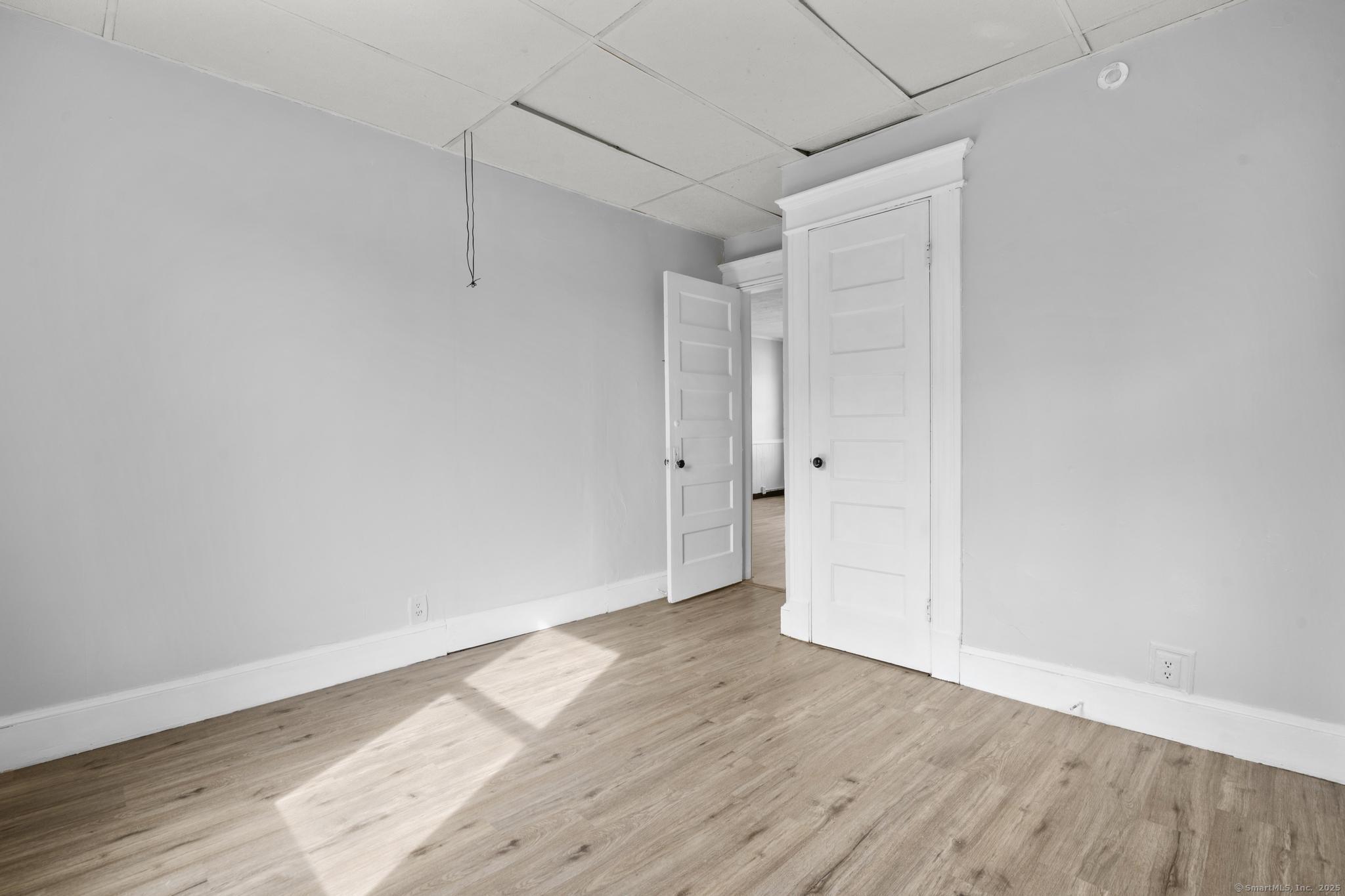 73 South Street Waterbury, CT 06706 - Photo 14 of 29 a view of an empty room with wooden floor