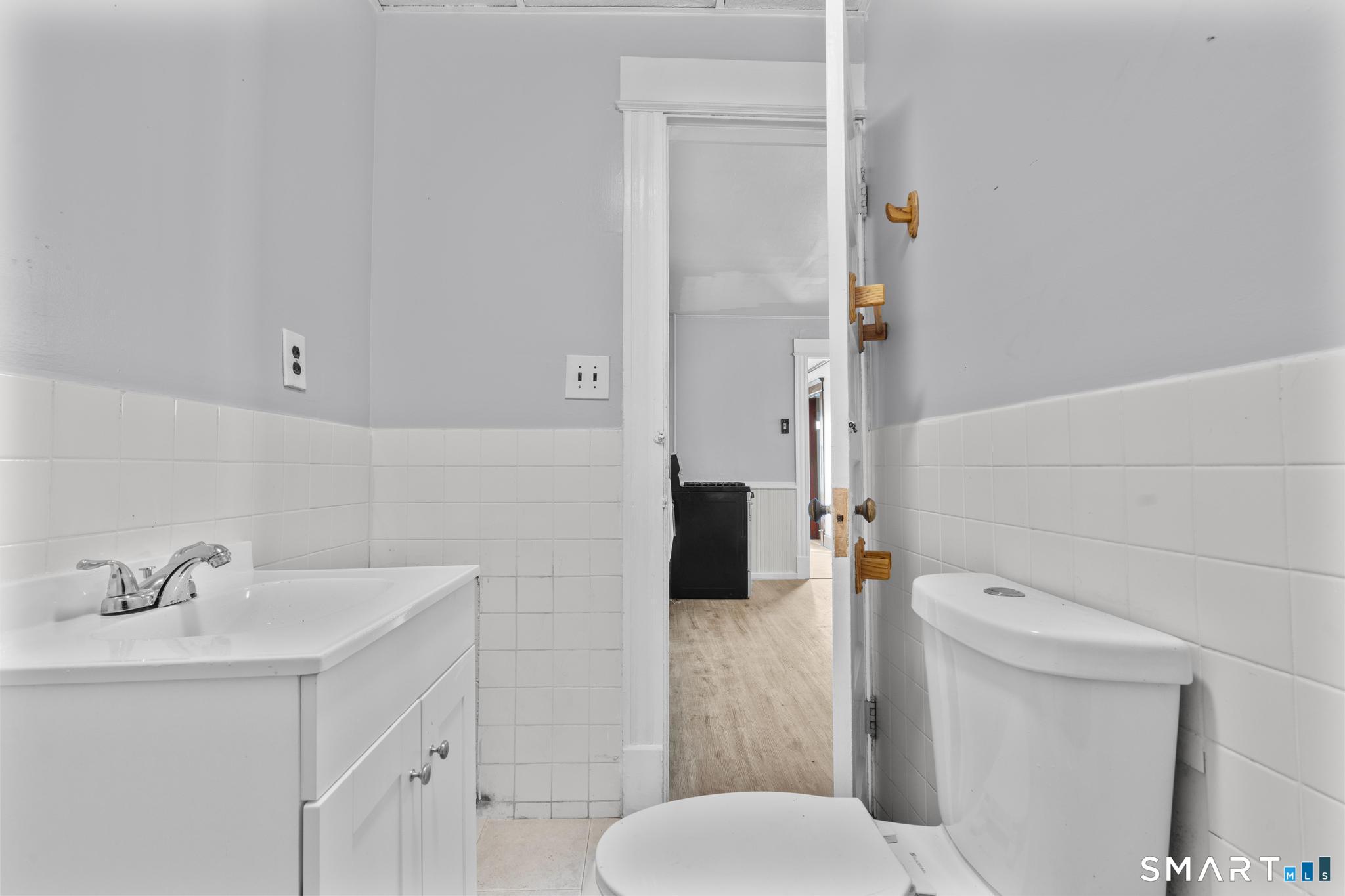 73 South Street Waterbury, CT 06706 - Photo 15 of 29 a bathroom with a toilet sink and shower