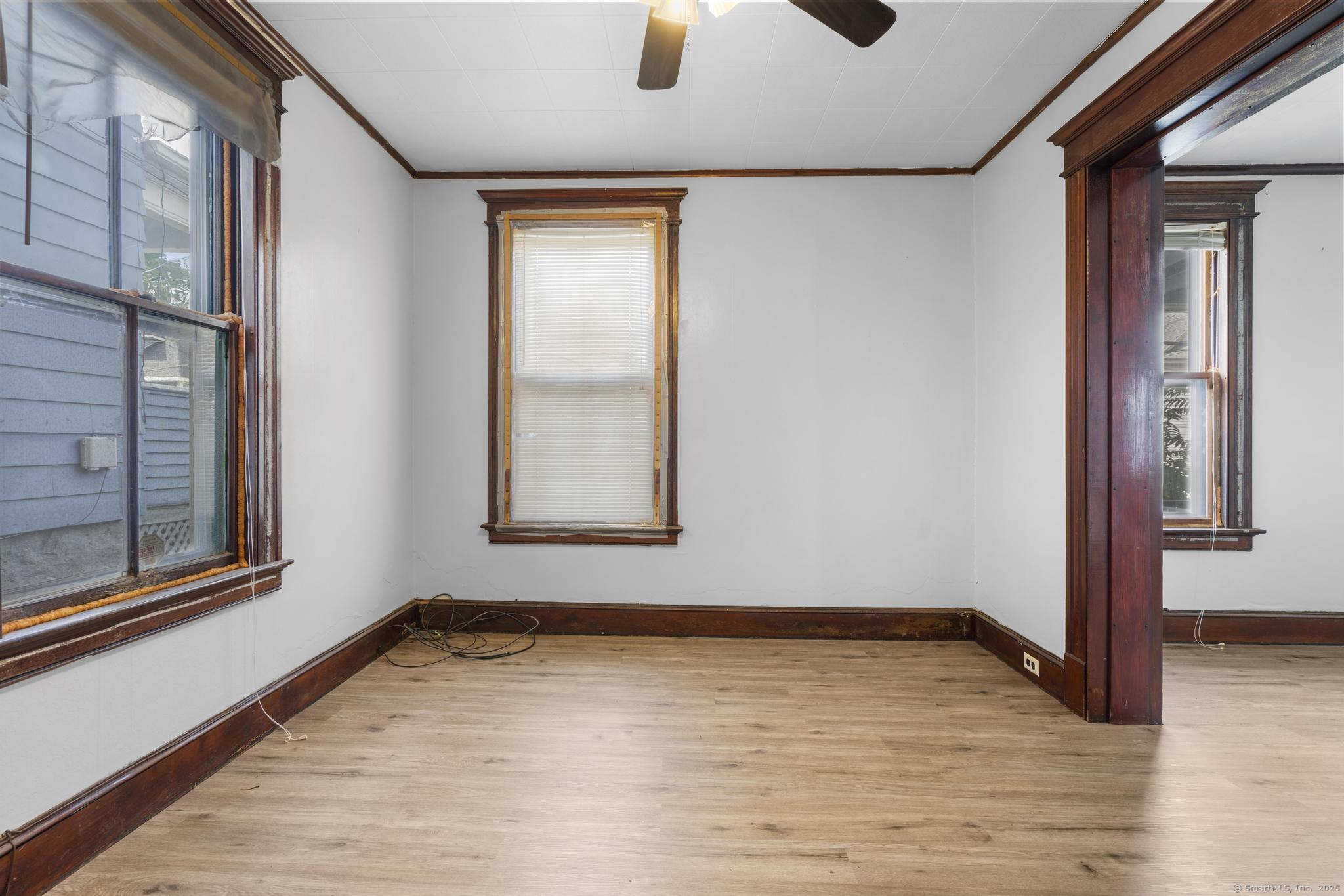 73 South Street Waterbury, CT 06706 - Photo 24 of 29 a view of an empty room with wooden floor and a window