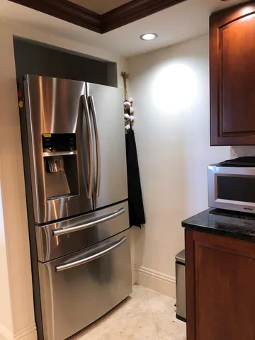a kitchen with a sink a stove and cabinets