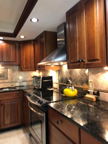 a bedroom with a bed and a large mirror