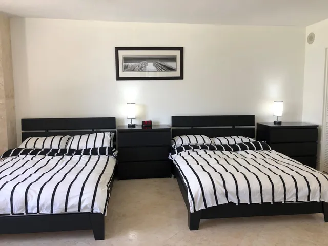 a living room with furniture and a lamp