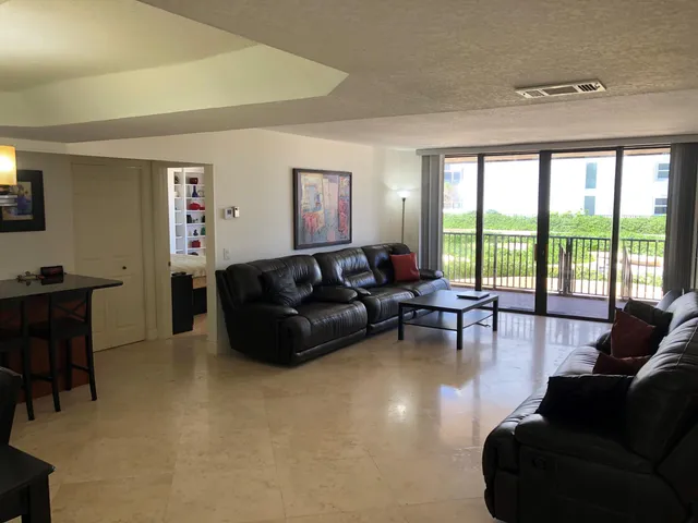a living room with furniture window and wooden floor