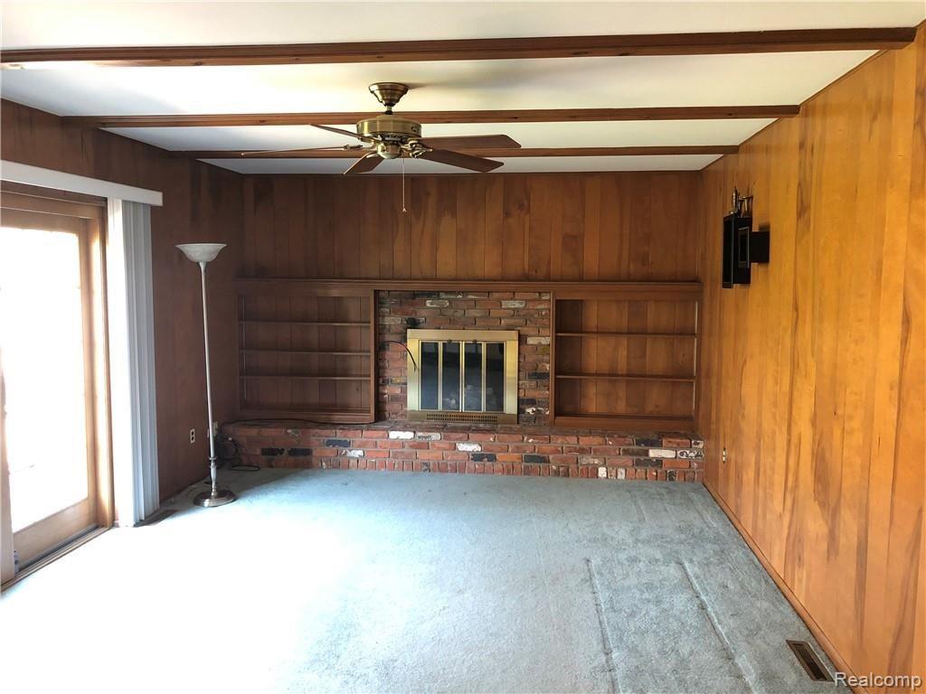 4311 East Cook Road Grand Blanc, MI 48439 - Photo 10 of 21 Family Room With Fireplace & Door Wall To Patio/Deck!