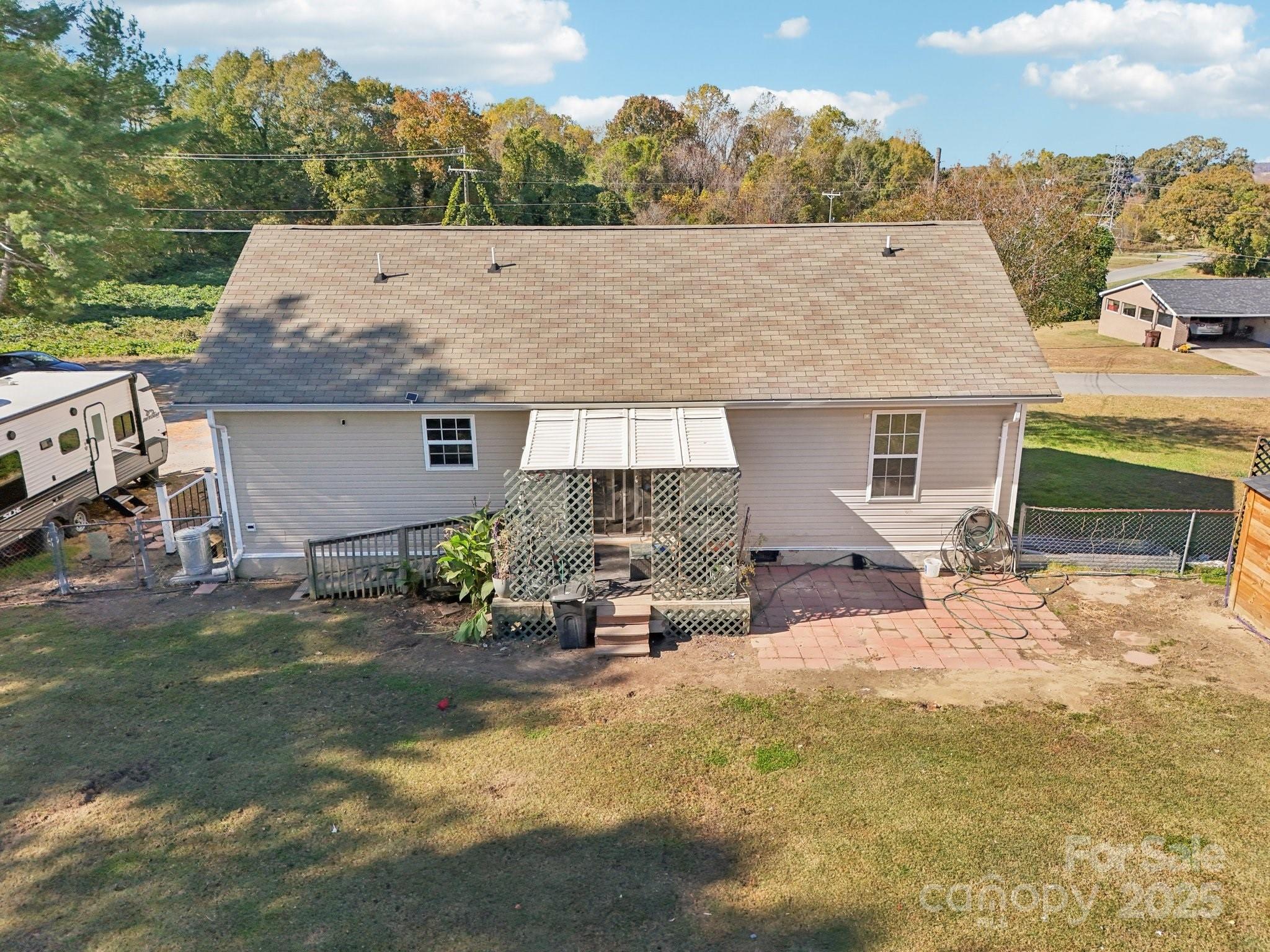 106 Williams Road Kings Mountain, NC 28086 - Photo 3 of 16 a backyard of a house with yard and outdoor seating