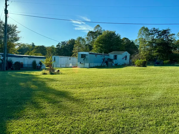a view of a swimming pool with a yard