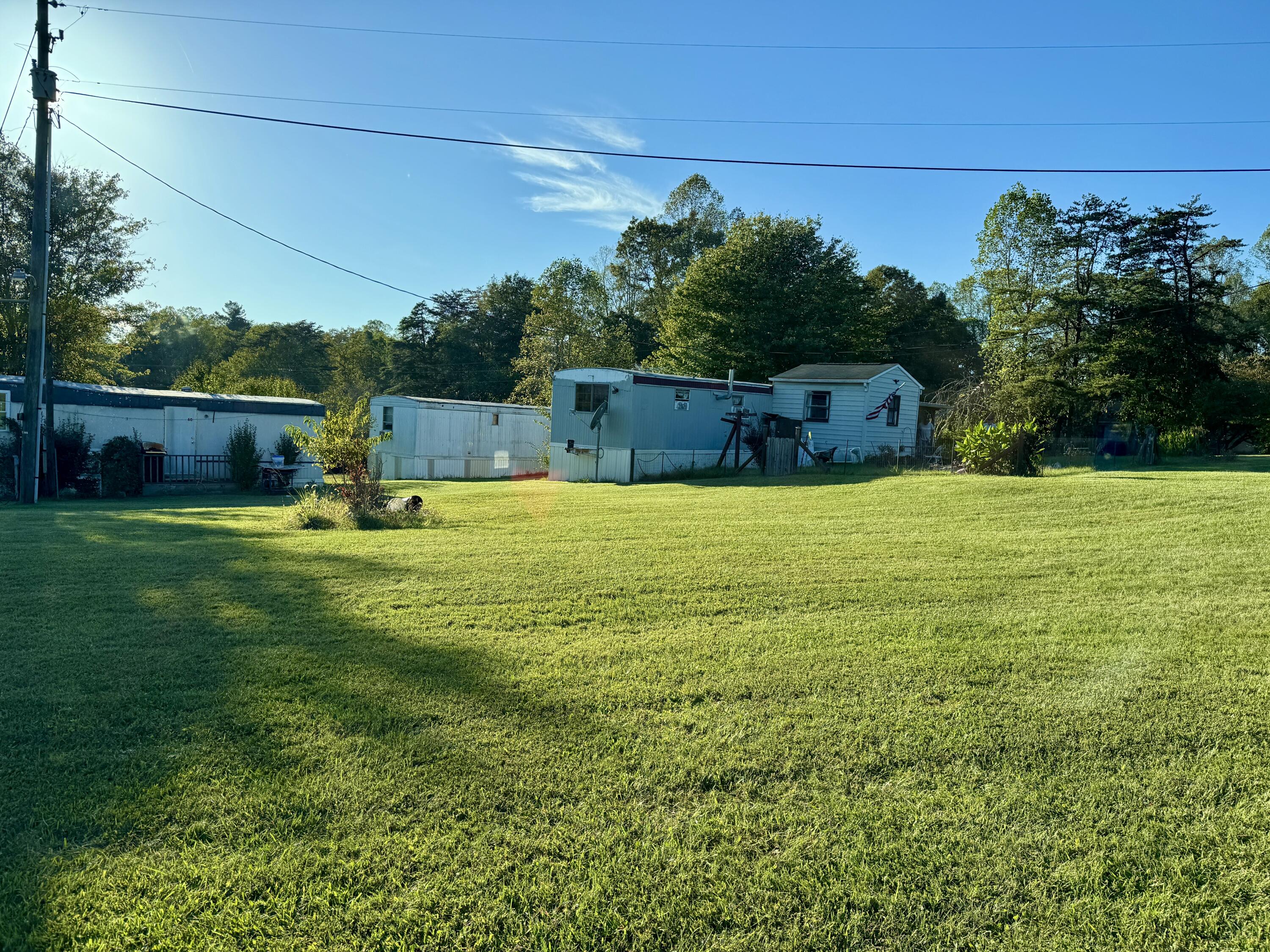 a view of a swimming pool with a yard