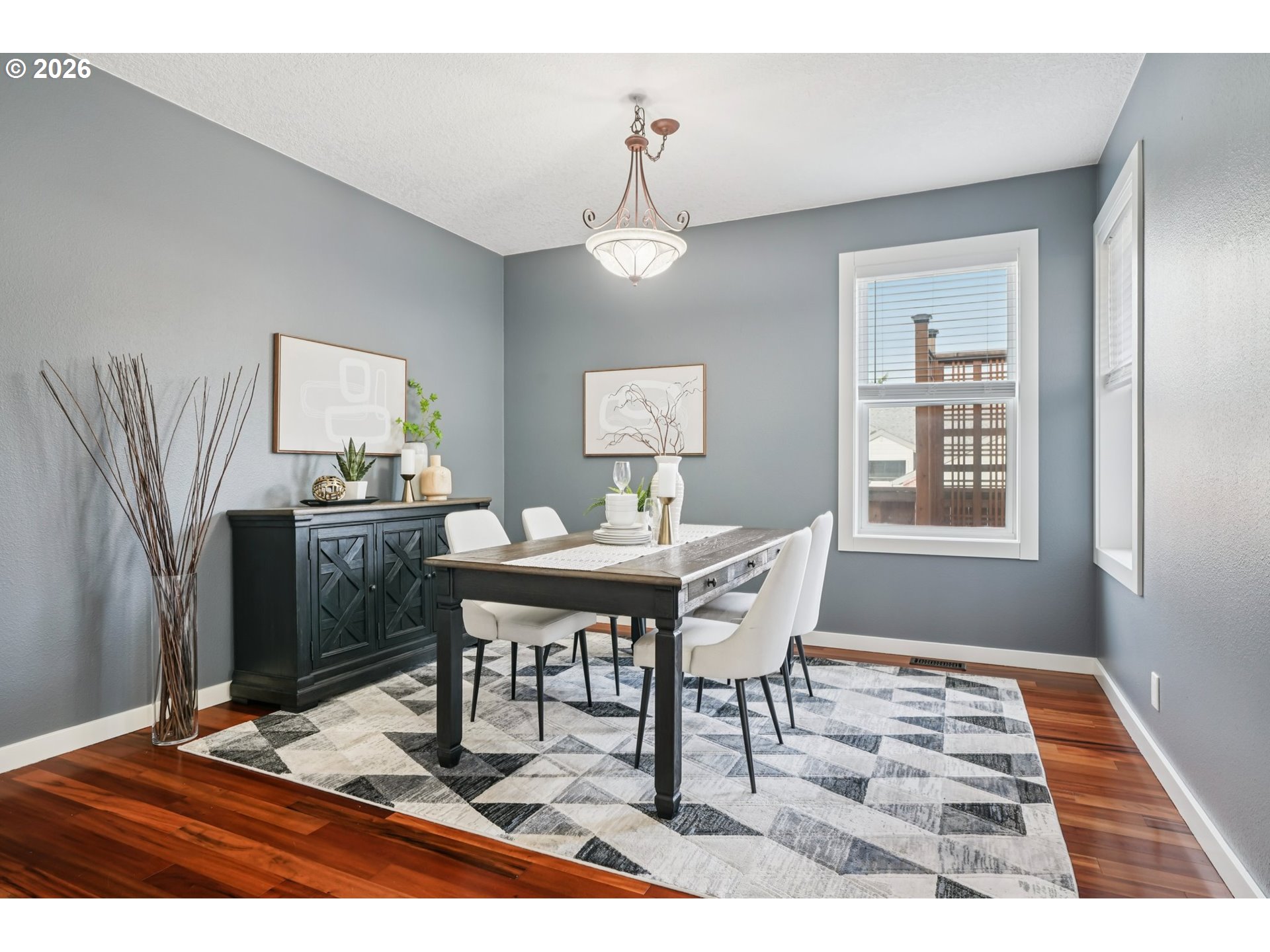 13728 Southwest 159th Terrace Portland, OR 97224 - Photo 14 of 48 a dining room with wooden floor a chandelier a wooden table and chairs