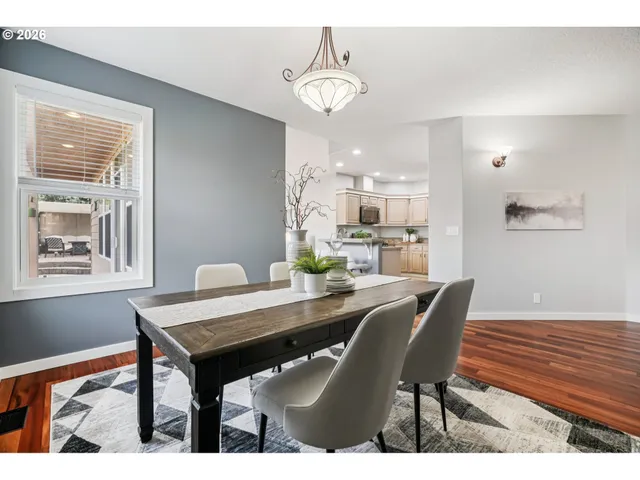 a bedroom with a bed a mirror and a window