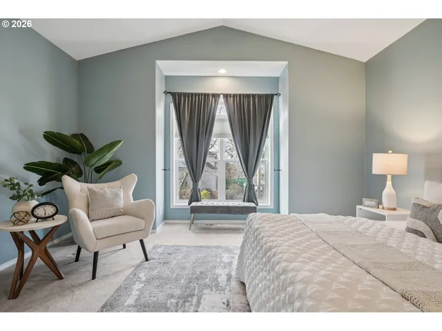 a bedroom with a bed and a couch