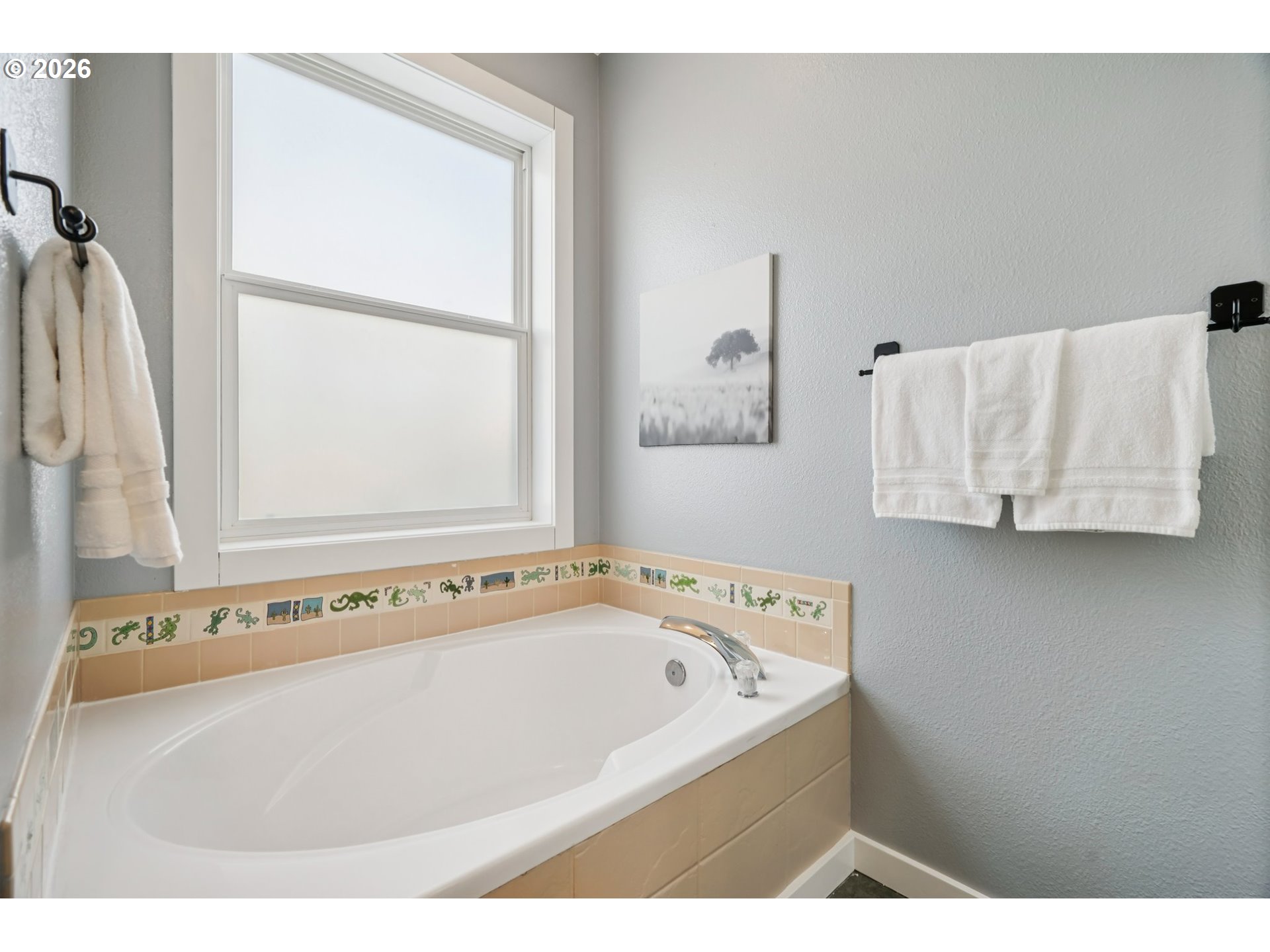 13728 Southwest 159th Terrace Portland, OR 97224 - Photo 20 of 48 a white bath tub sitting next to a white cabinet