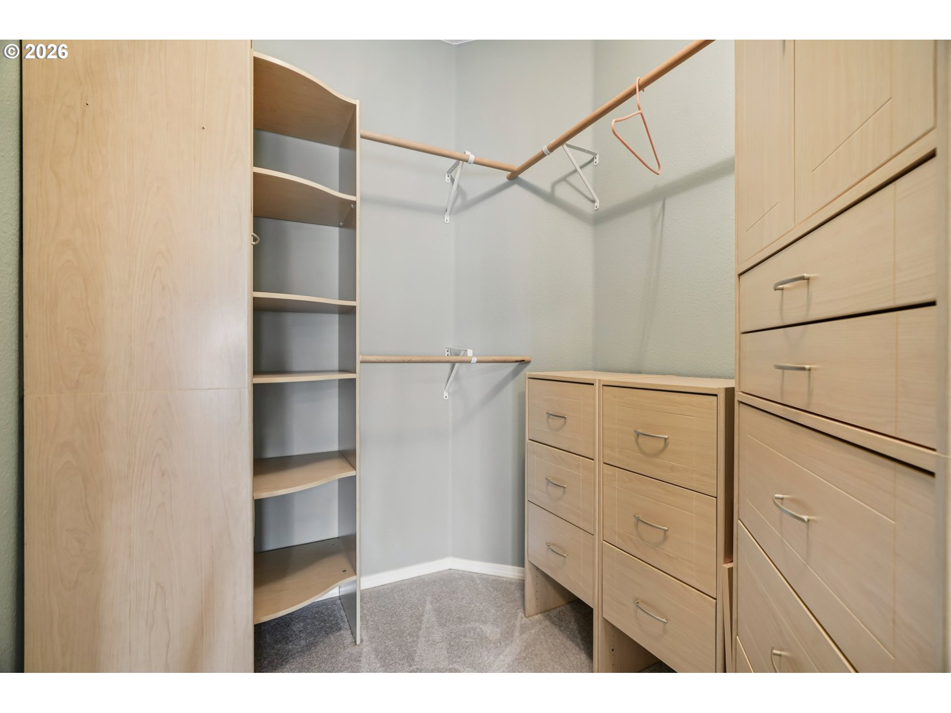 13728 Southwest 159th Terrace Portland, OR 97224 - Photo 21 of 48 a view of walk in closet with empty racks