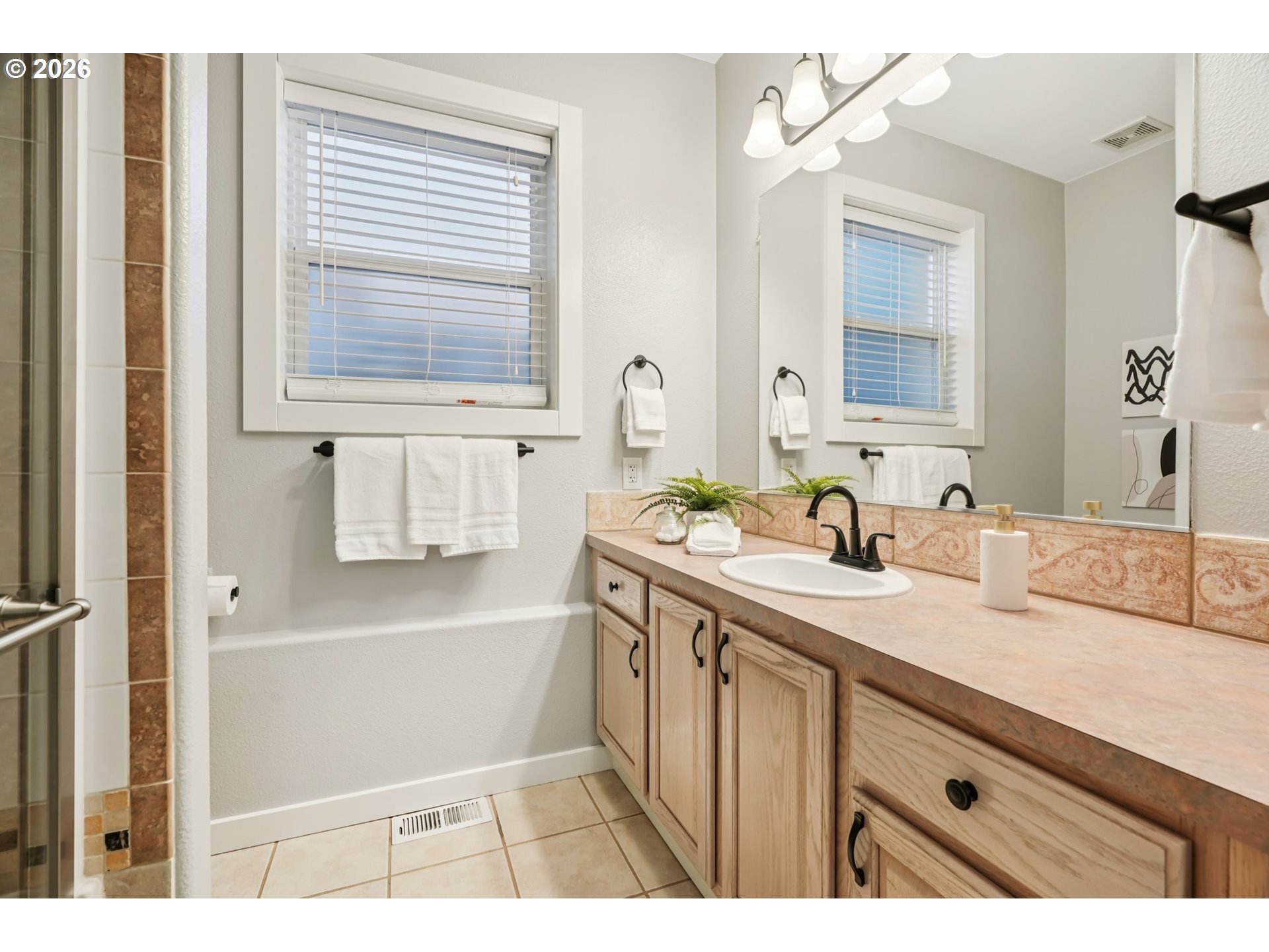 13728 Southwest 159th Terrace Portland, OR 97224 - Photo 23 of 48 a bathroom with a sink a vanity and a mirror