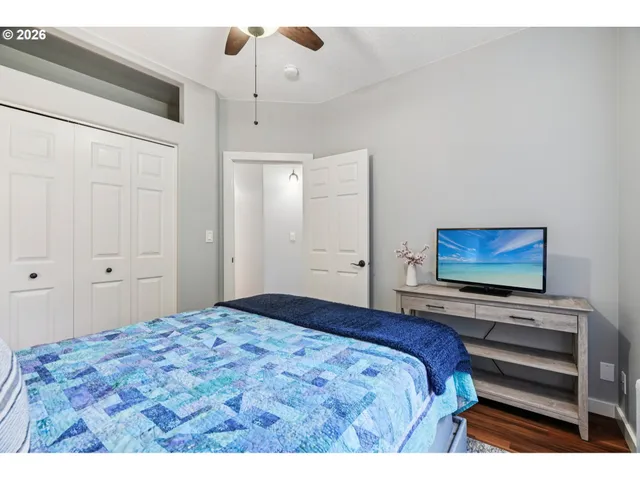 a living room with furniture a piano and a bookshelf
