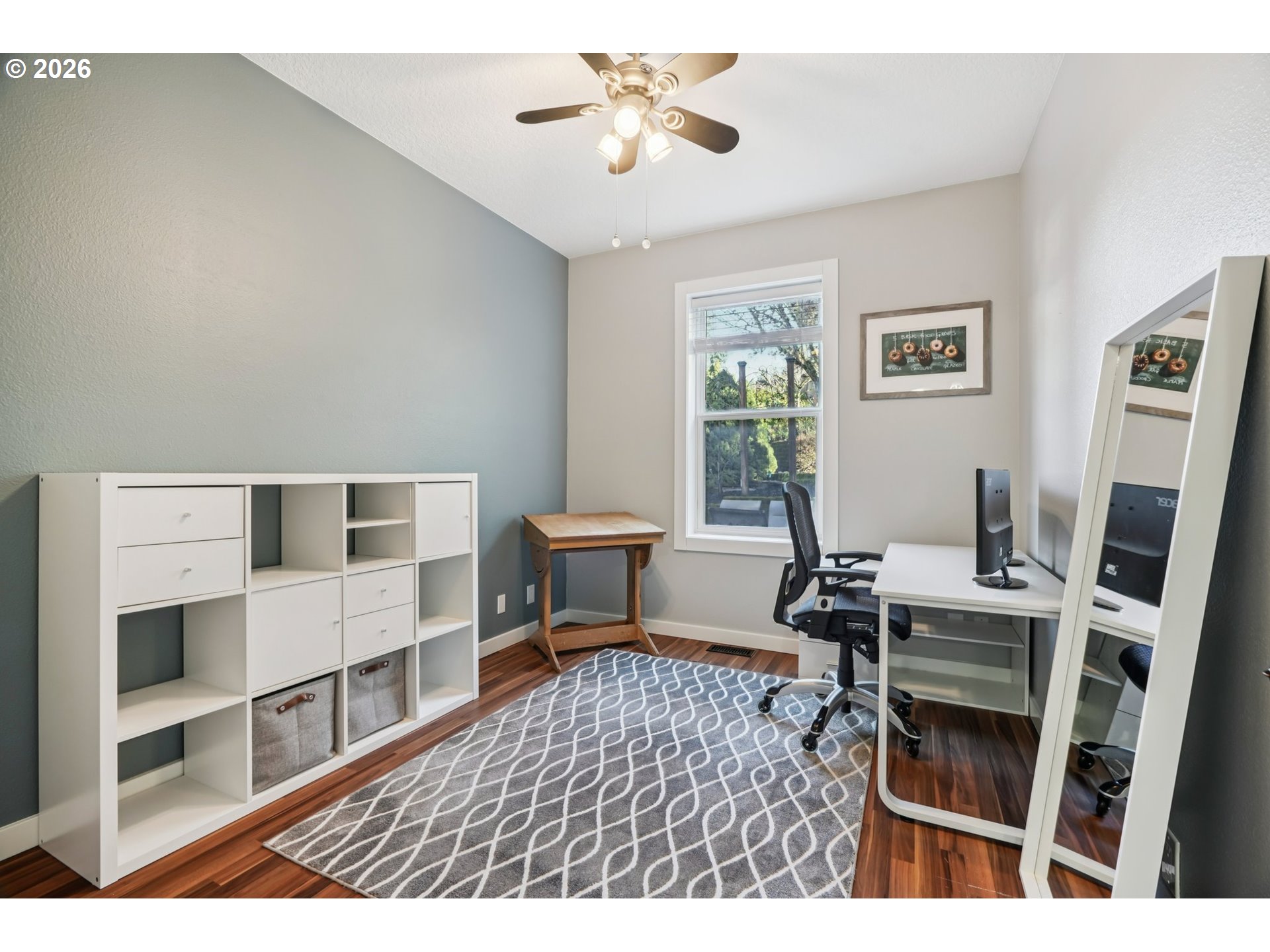 13728 Southwest 159th Terrace Portland, OR 97224 - Photo 26 of 48 a living room with furniture a piano and a bookshelf