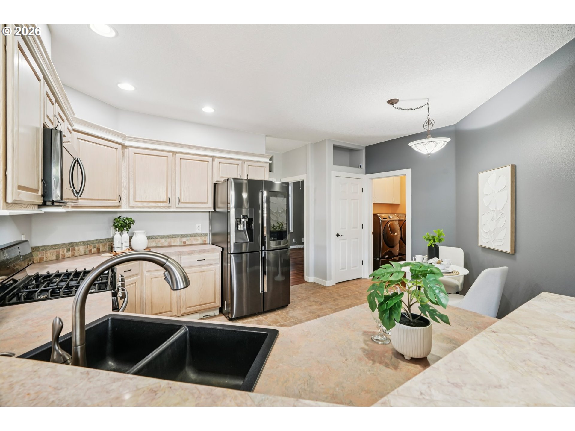 13728 Southwest 159th Terrace Portland, OR 97224 - Photo 10 of 48 a kitchen with a sink stainless steel appliances and cabinets
