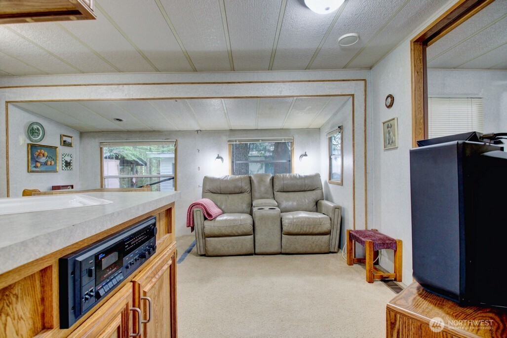 22 Wilderness Way Maple Falls, WA 98266 - Photo 14 of 40 a living room with furniture and a flat screen tv