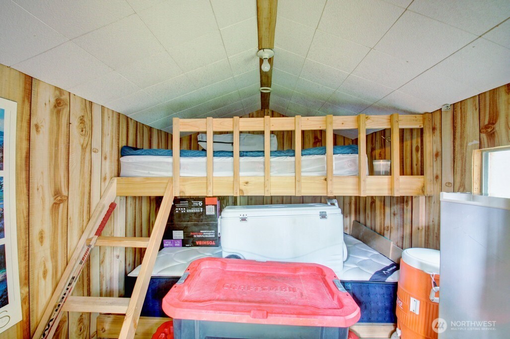 22 Wilderness Way Maple Falls, WA 98266 - Photo 28 of 40 a bedroom with furniture and wooden floor