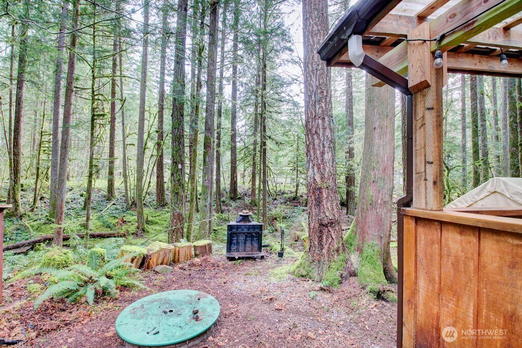 22 Wilderness Way Maple Falls, WA 98266 - Photo 3 of 40 a backyard of a house with outdoor seating