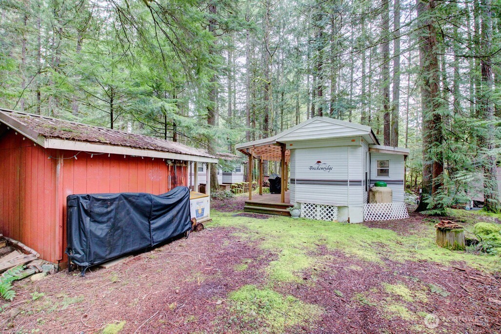 22 Wilderness Way Maple Falls, WA 98266 - Photo 6 of 40 a view of a house with a yard and sitting area