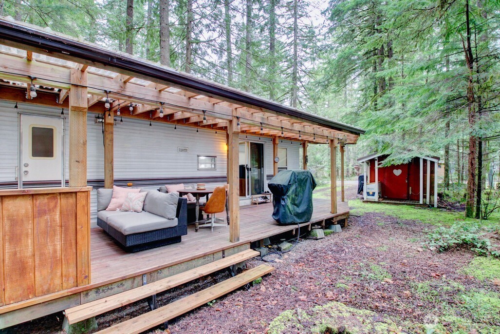 22 Wilderness Way Maple Falls, WA 98266 - Photo 10 of 40 a view of the back of a house with a patio