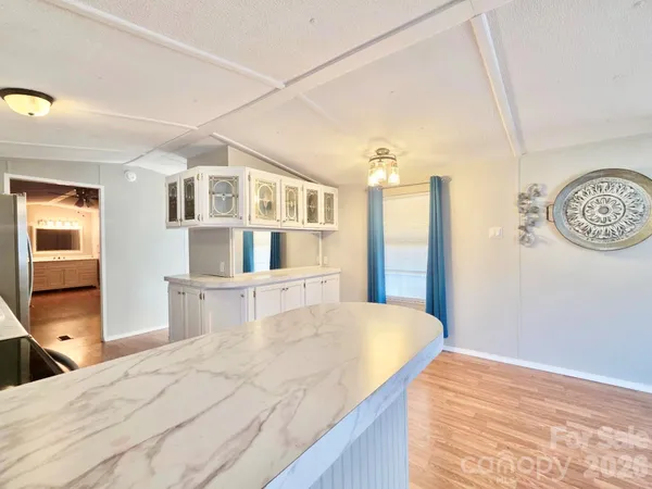 a bedroom with a bed and a table in it