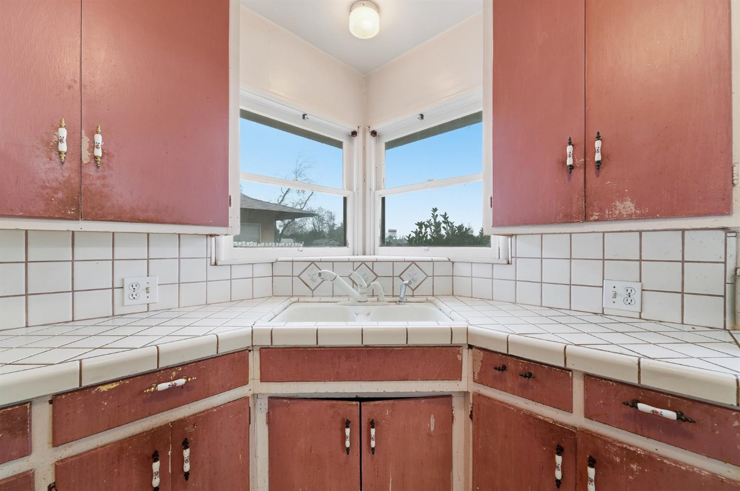1127 West 19th Street Merced, CA 95340 - Photo 11 of 28 a kitchen with a sink and cabinets