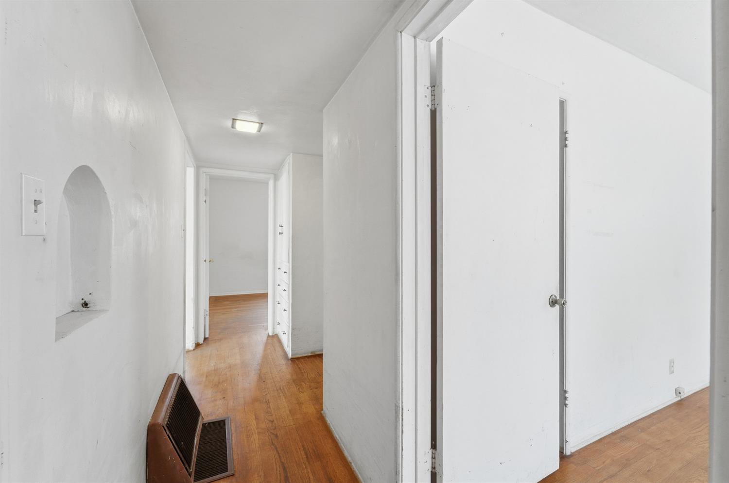 1127 West 19th Street Merced, CA 95340 - Photo 15 of 28 a view of a hallway with wooden floor