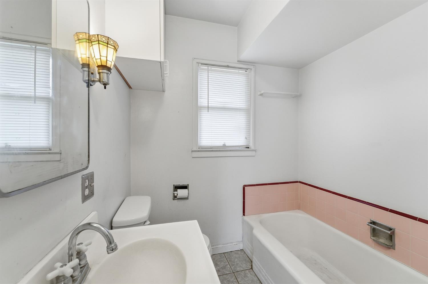 1127 West 19th Street Merced, CA 95340 - Photo 19 of 28 a bathroom with a sink and a mirror