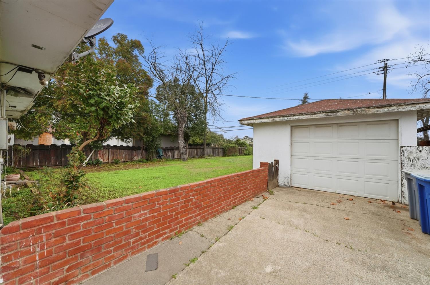 1127 West 19th Street Merced, CA 95340 - Photo 23 of 28 a view of a house with a yard and garage