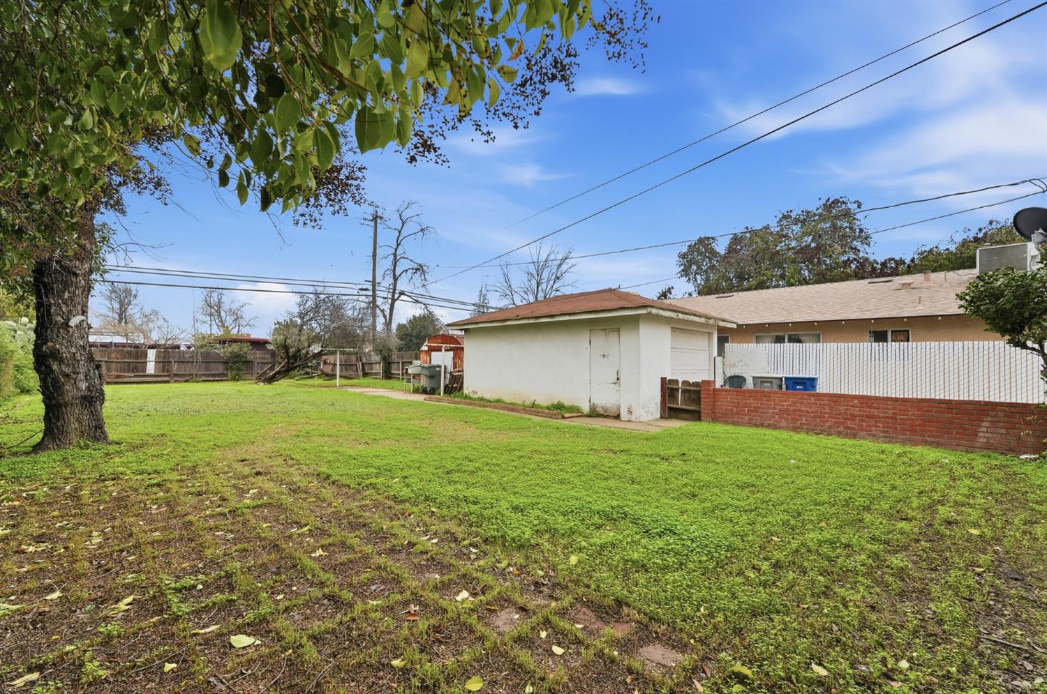 1127 West 19th Street Merced, CA 95340 - Photo 25 of 28 a view of a house with a yard