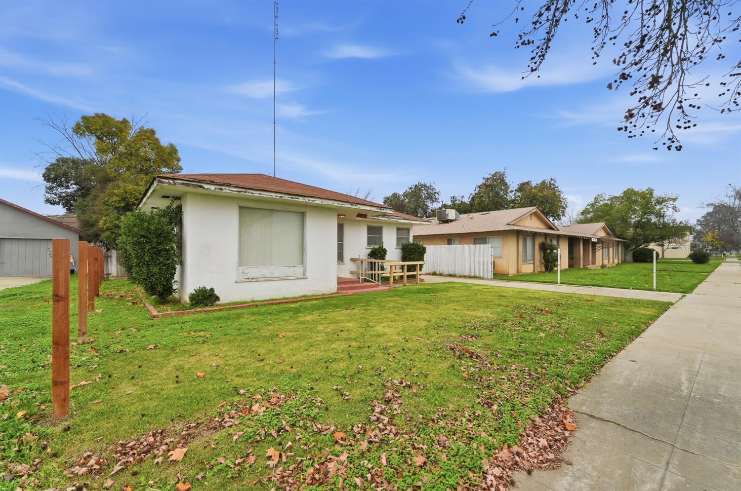 1127 West 19th Street Merced, CA 95340 - Photo 3 of 28 a front view of a house with garden