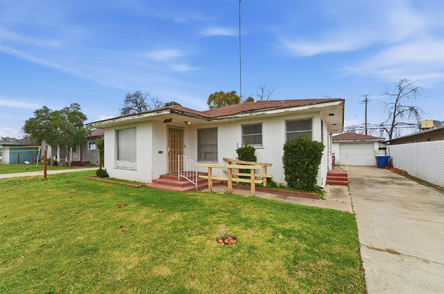 1127 West 19th Street Merced, CA 95340 - Photo 4 of 28 a view of a house with a backyard and a porch