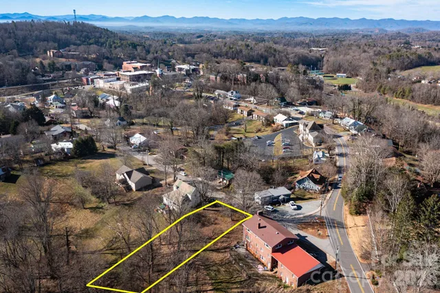an aerial view of a residential houses with outdoor space