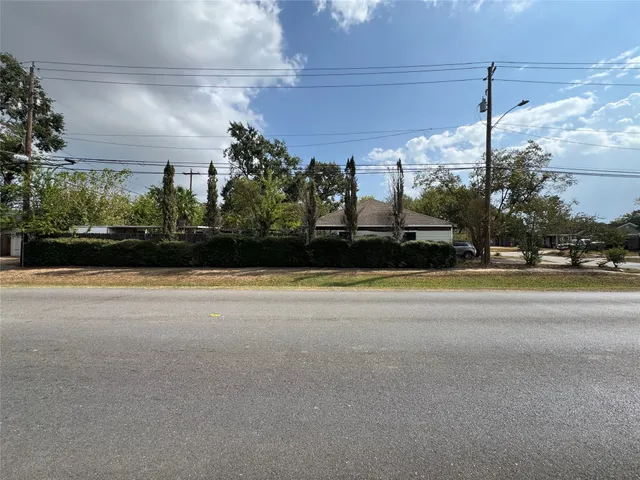 a view of street with a cars parked on road