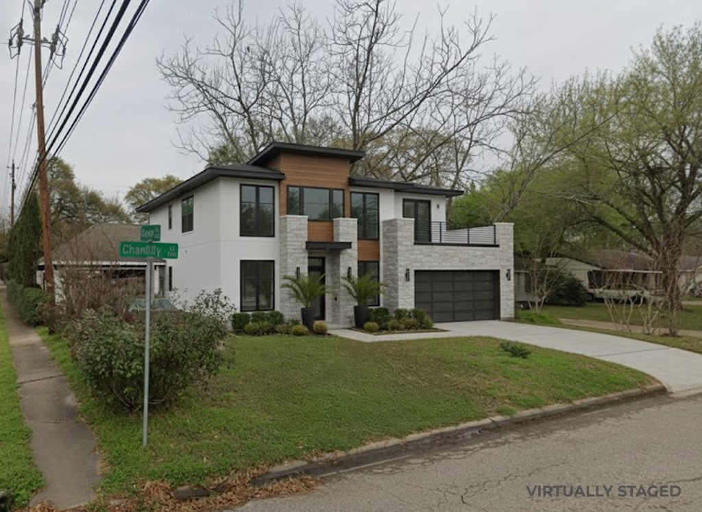 1730 Chantilly Lane Houston, TX 77018 - Photo 6 of 8 a front view of a house with a garden and trees